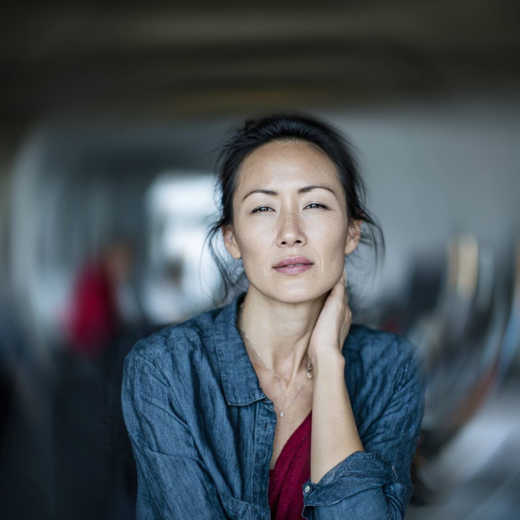 Woman holding her neck in pain.
