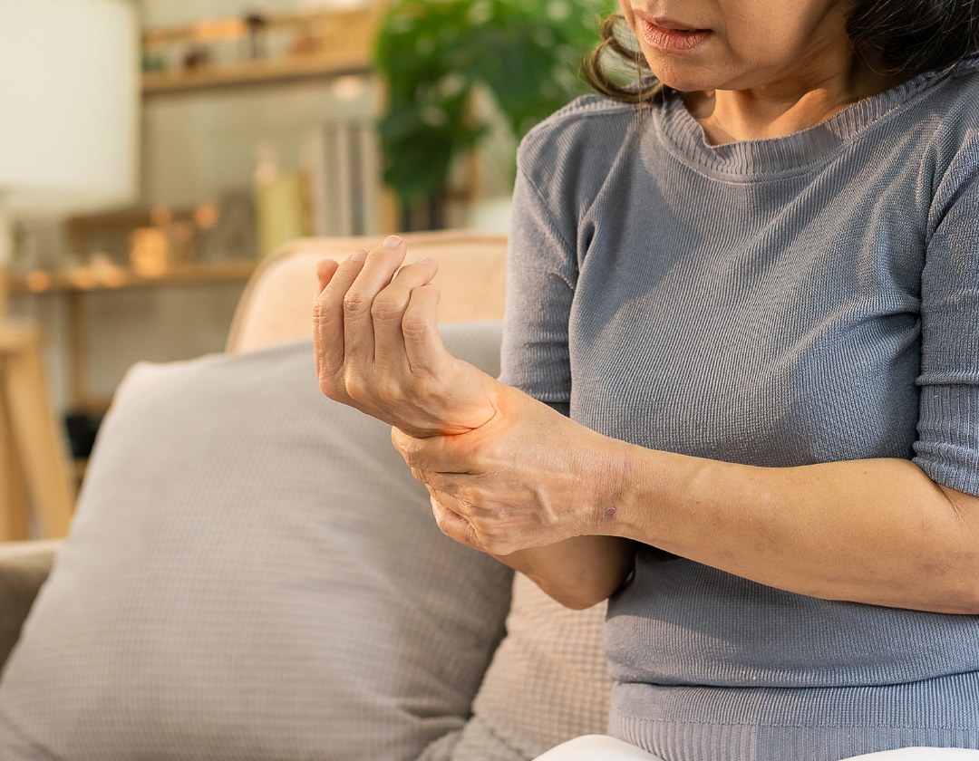 women holding wrist in pain
