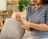 women holding wrist in pain