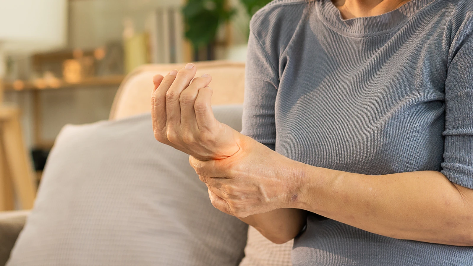 women holding wrist in pain