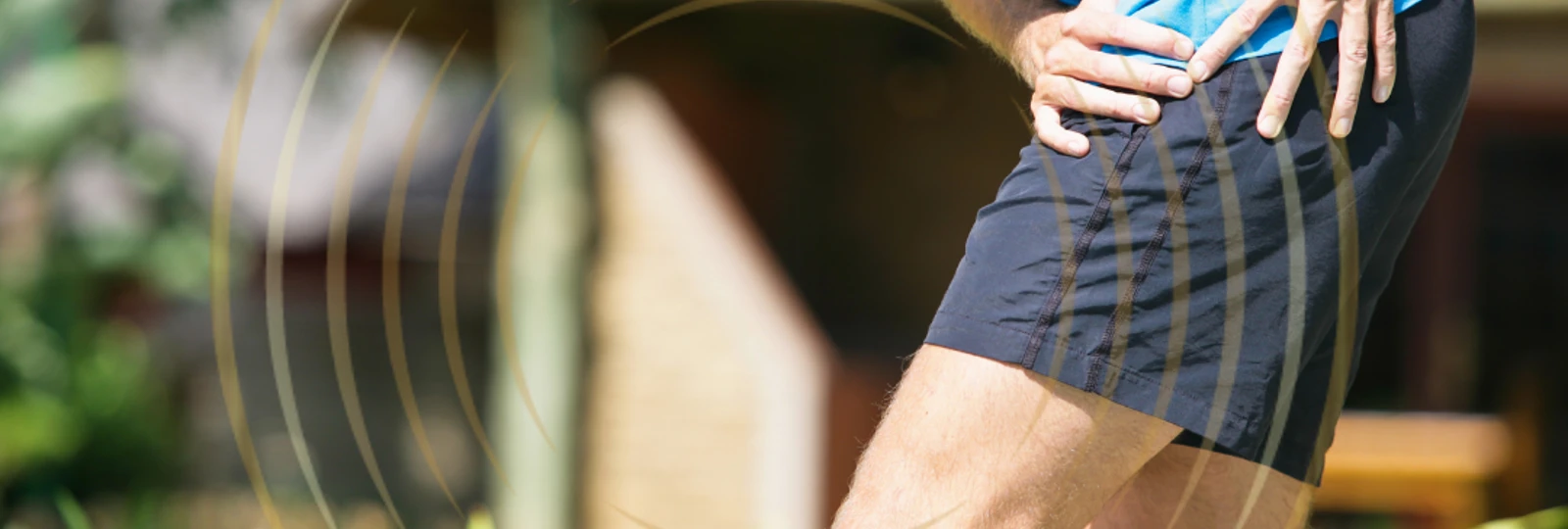 man holding hip in pain